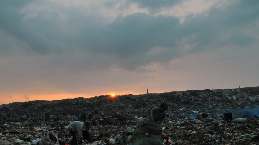 Earning a living at Hanoi landfill at night