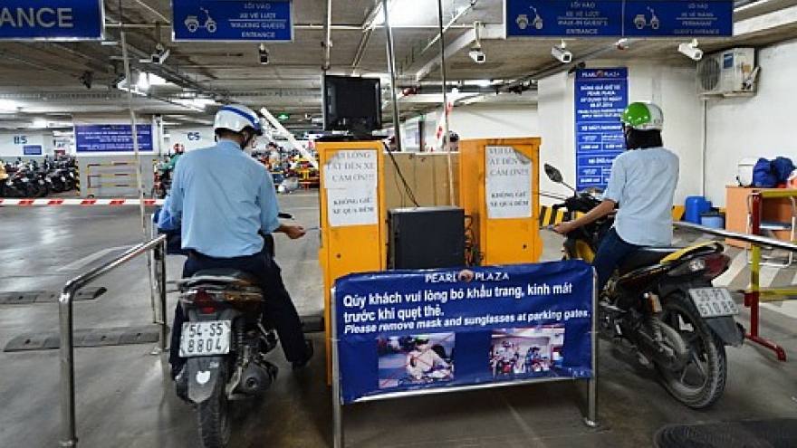 Saigon’s parking lot owners say one-price regulation unfair