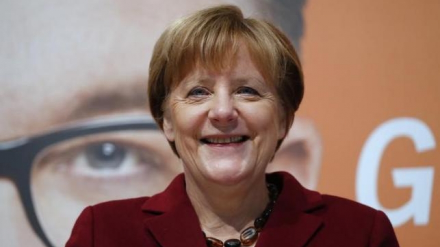 Merkel crosses fingers before German 'Super Sunday' regional polls