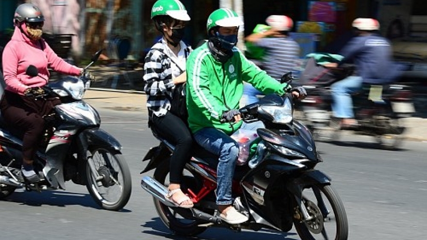 Traditional motorbike taxi drivers grapple with technology invasion