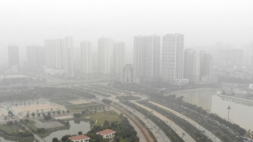 High-rise buildings hidden as dense fog hits Hanoi