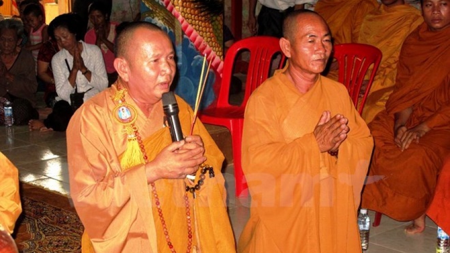 OVs in Cambodia offer incense to martyrs