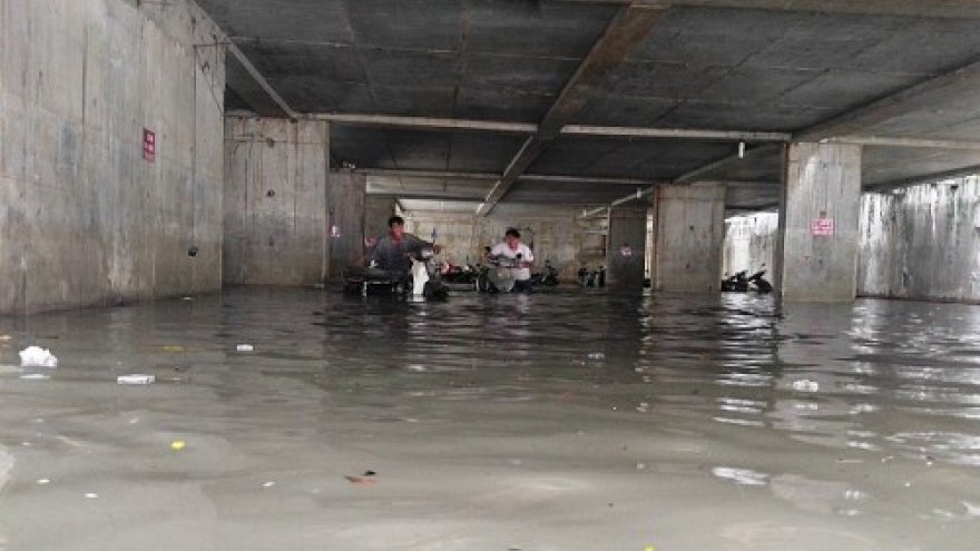 Issues emerge as heavy storms flood parking basements in HCM City