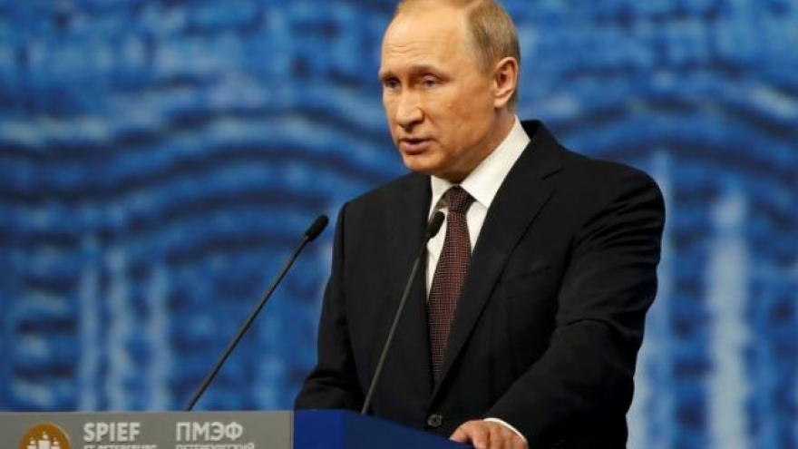 
        Putin says accepts US is sole superpower, dilutes Trump praise
                              