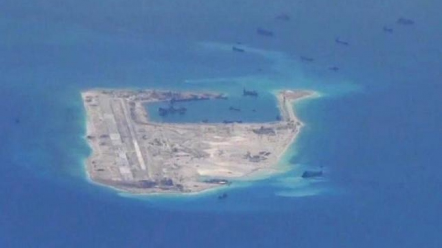 Kerry warns Beijing over air defense zone for South China Sea