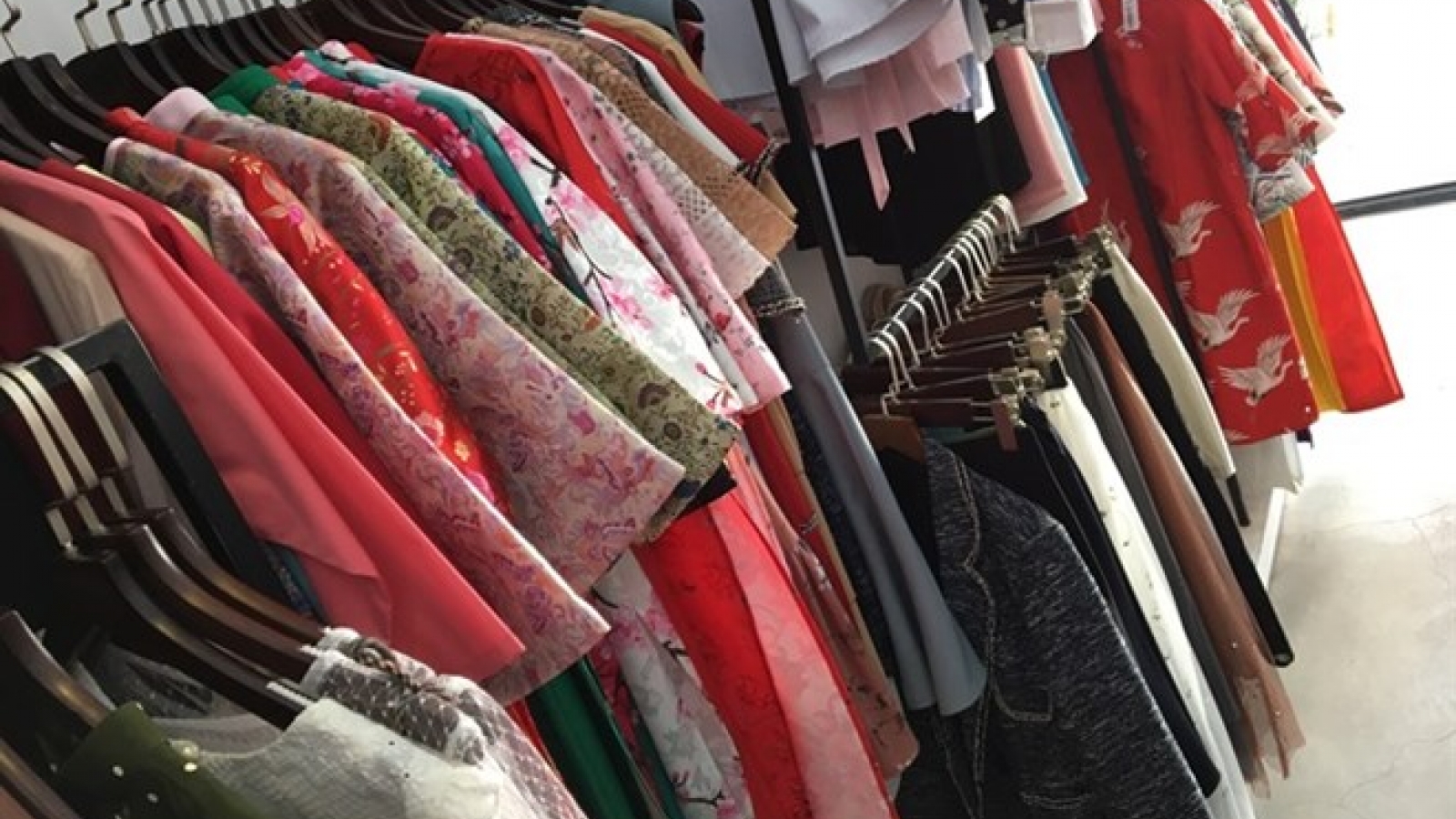 Young people shop for affordable, ready-to-wear ao dai for Tet