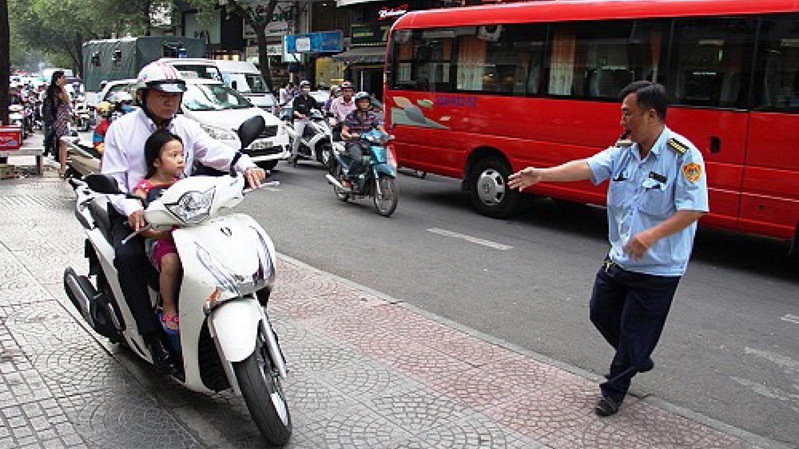 Hundreds fined as Saigon puts the brakes on sidewalk driving