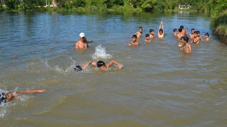 Children in Quang Ngai taught swimming skills in river