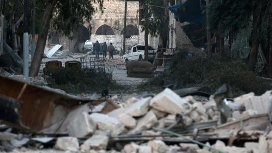 Syrian family, pupils among dozens killed in Aleppo attacks