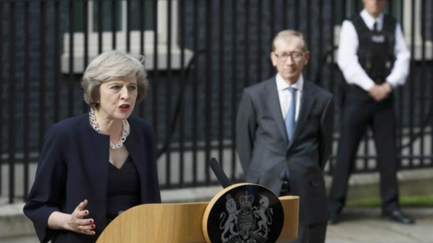 Britain's new PM May gives Johnson big job, says needs time before Brexit talks