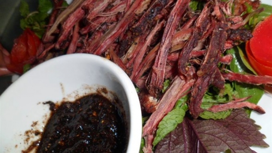 Dishing out “buffalo meat hung up in kitchen“