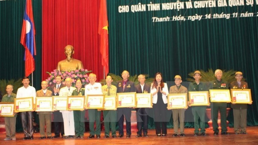 Laos honours Vietnamese voluntary soldiers, experts