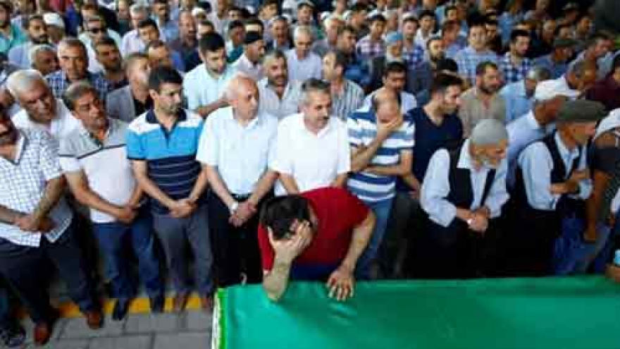 Turkey's Erdogan blames child bomber for attack that killed 51