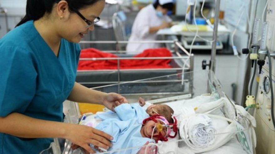 Vietnamese conjoined twin girls to be separated next month