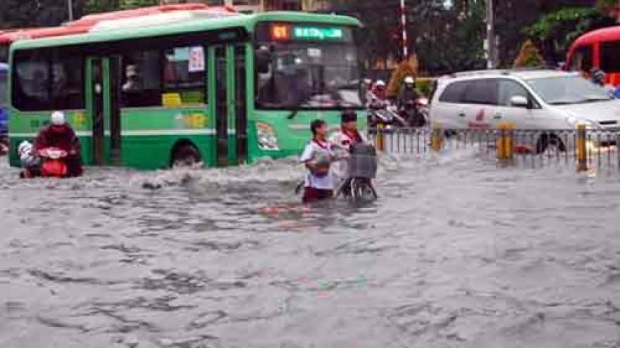 
        Vietnam eyes ending flooding in urban centres by 2050
                              