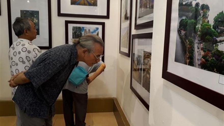 
        Photo exhibition highlights Hanoi’s past, present architecture
                              