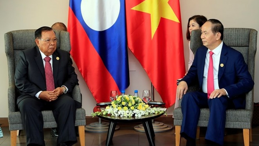President Quang meets with top leader of Laos