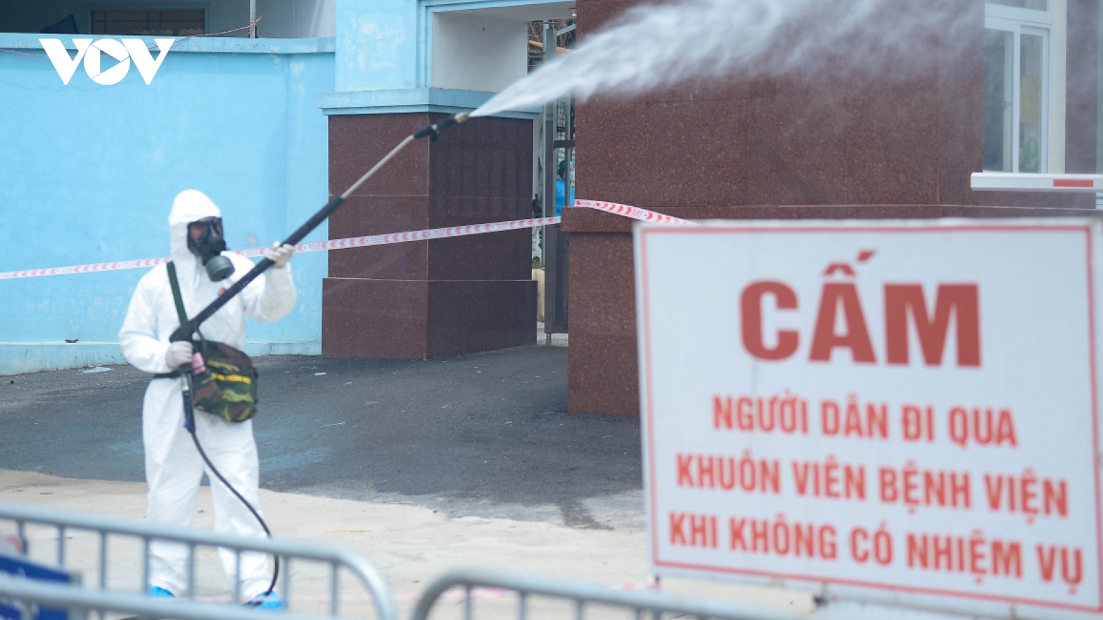 Military forces spray disinfectant at K Hospital's Tan Trieu medical facility
