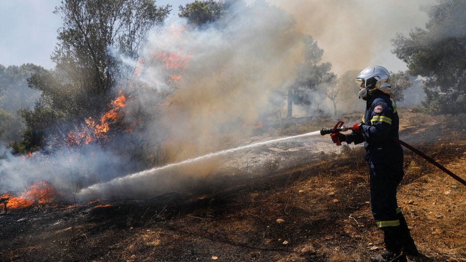 2022-07-20T103147Z_679072836_RC2KFV9STHOG_RTRMADP_3_EUROPE-WEATHER-GREECE-WILDFIRES.JPG