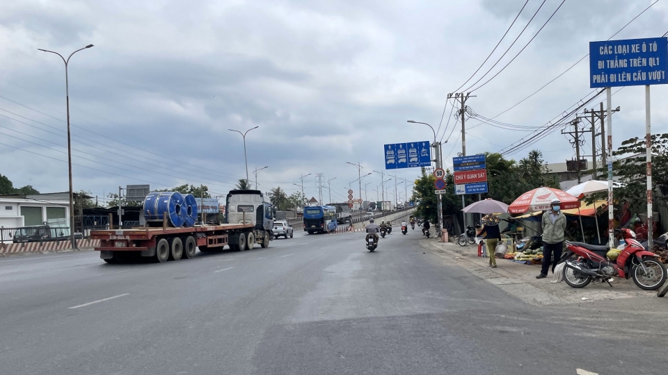quoc_lo_1_di_qua_dia_ban_tphcm.jpg