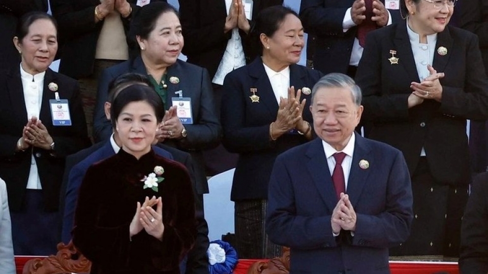 General Secretary To Lam and his wife attend the 50th anniversary of Laos’ National Day.jpg