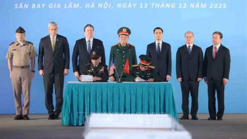 Signing ceremony for the 171st repatriation of remains of US service members.jpg