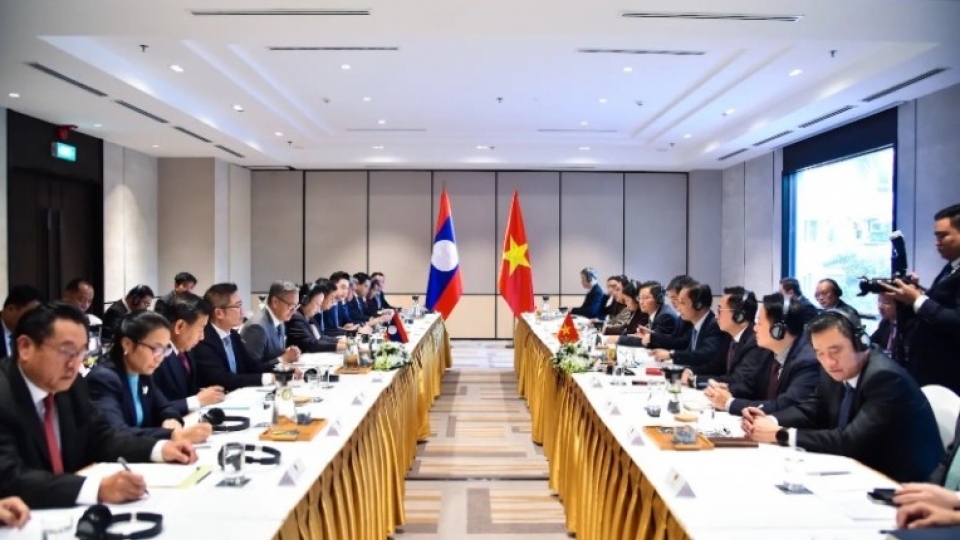 Vietnamese Foreign Minister Le Hoai Trung and Lao Foreign Minister Thongsavanh Phomvihane co-chair the 12th annual Ministerial Political Consultation.jpg