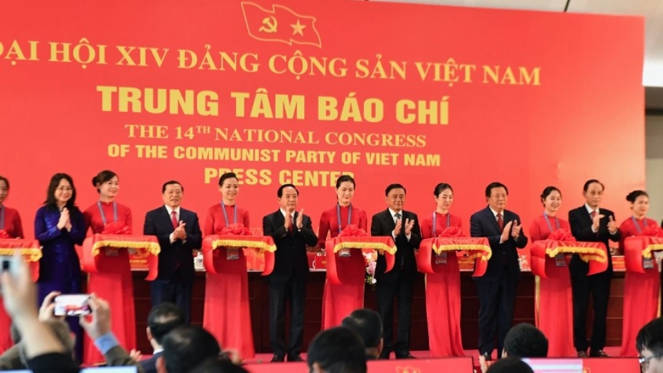 Delegates perform the ribbon-cutting ceremony to inaugurate the Press Center for the 14th Party Congress.jpg