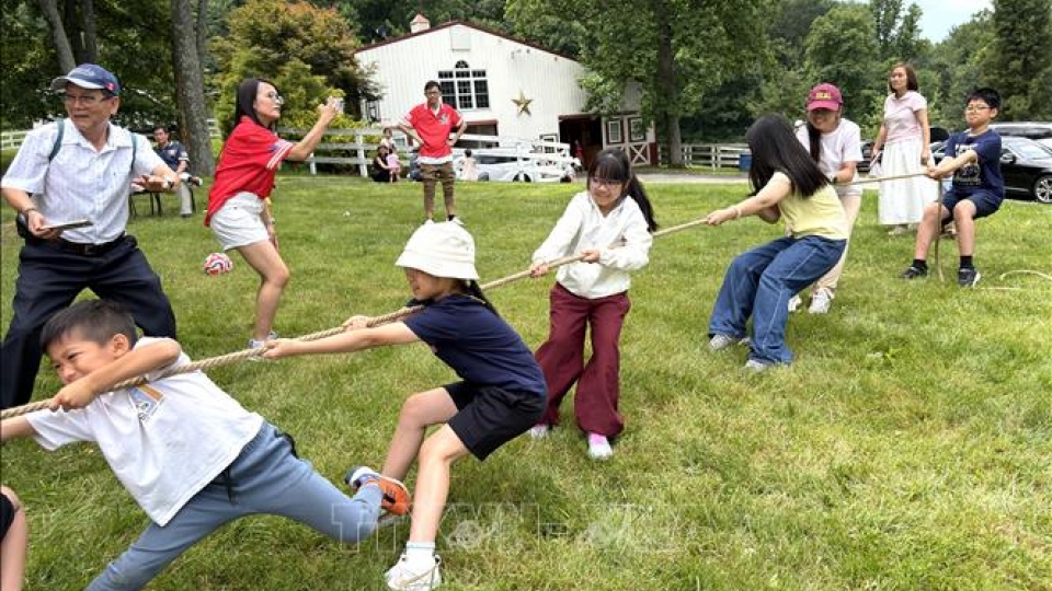 Children take part in a tug-of-war game in an enthusiastic atmosphere, helping boost team spirit.jpg