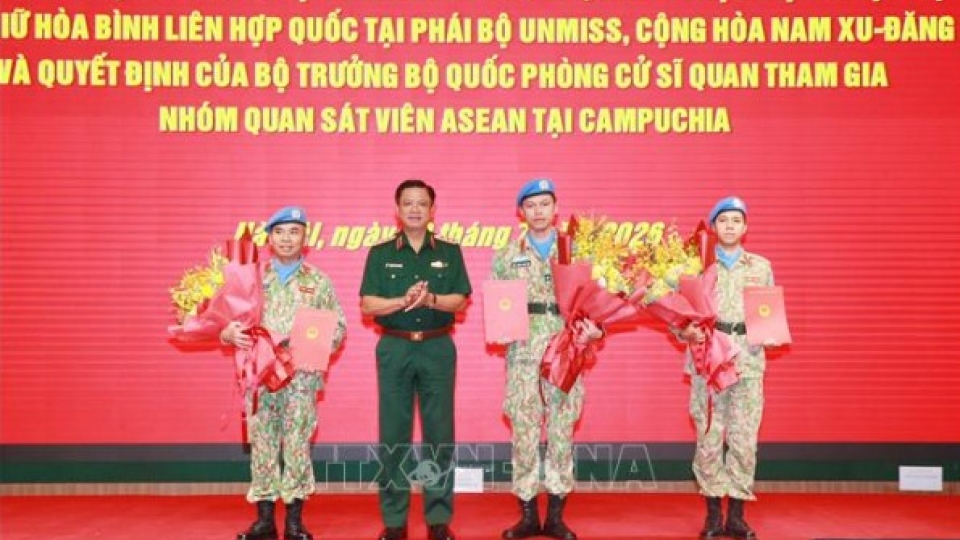 Deputy Minister of National Defense, presents the President’s decision to officers.jpg