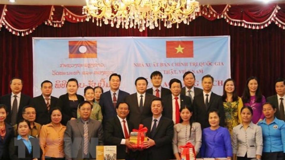 Political theory books presented to Laos