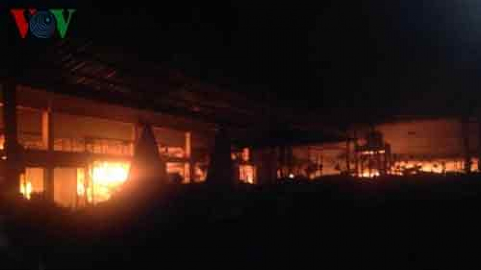 Vietnamese market fire smoulders in Laos