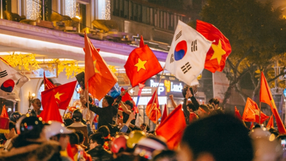 Football fans storm city streets to celebrate historic Asian Cup victory
