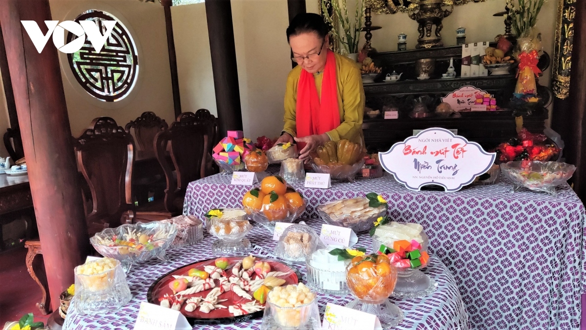 During the duration of the festival 150 booths are present to showcase the food and delicacies of each region nationwide. Photographed is artisan Ho Dac Thieu Anh arranging the traditional food of the central region.