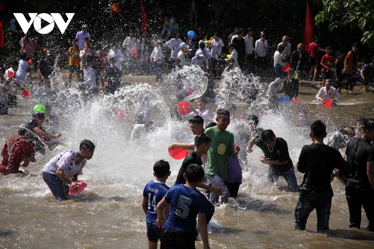 Many local residents join with visitors as they enjoy throwing and splashing water on each other.