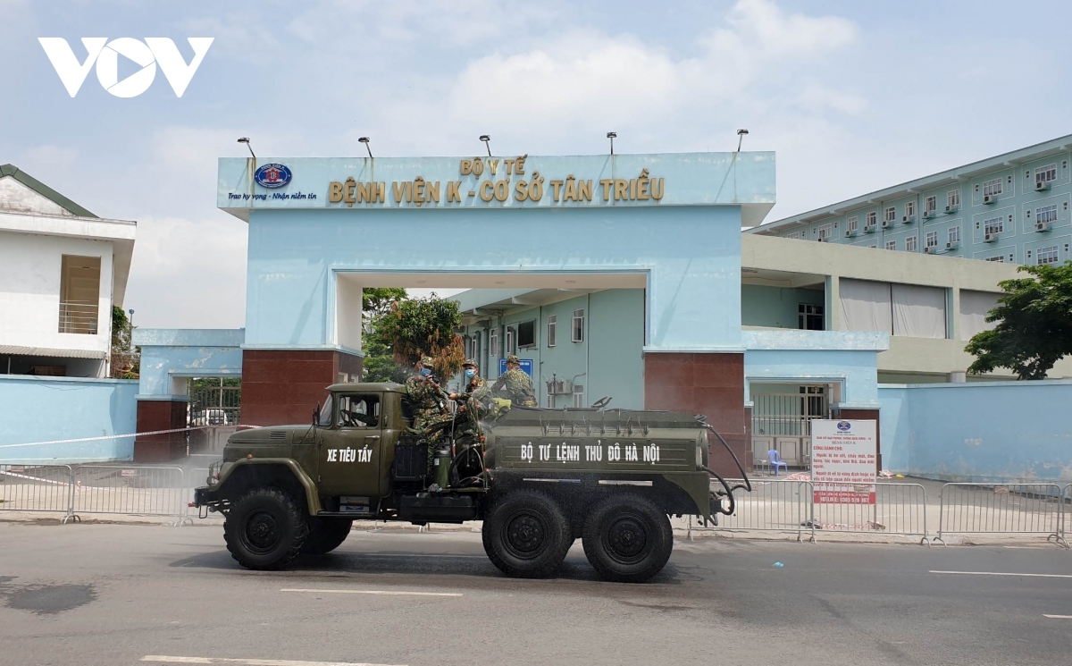 military forces spray disinfectant at k hospital s tan trieu medical facility picture 1