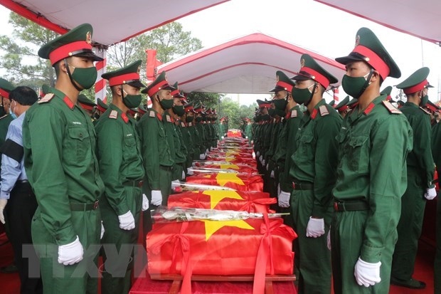 remains of martyrs repatriated from laos reburied in nghe an, thanh hoa picture 1