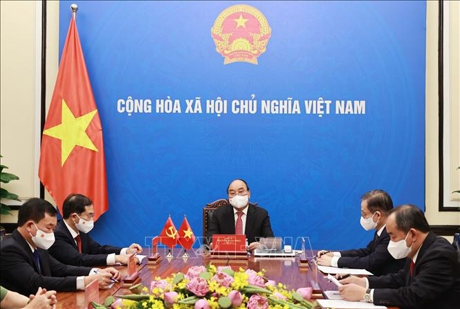 State President Nguyen Xuan Phuc has invited Chinese Party General Secretary and State President Xi Jinping to visit Vietnam during his phone talks with the top Chinese leader on May 24. (Photo:: VNA)