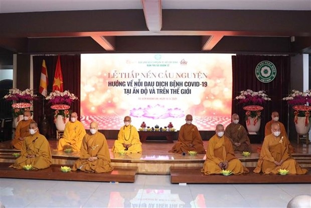 hcm city monks, buddhist followers offer prayers to covid-19-hit india picture 1