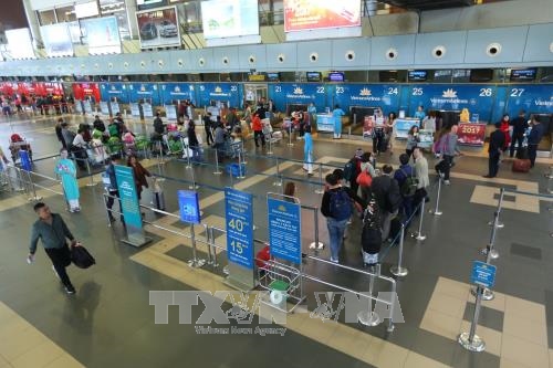 Passengers checking in at Noi Bai Airport