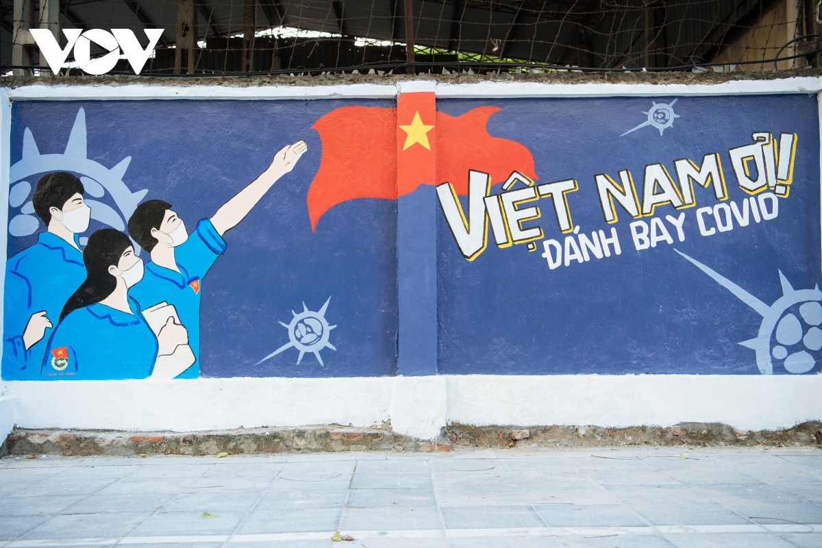 hanoi mural street features paintings showing covid-19 fight picture 14