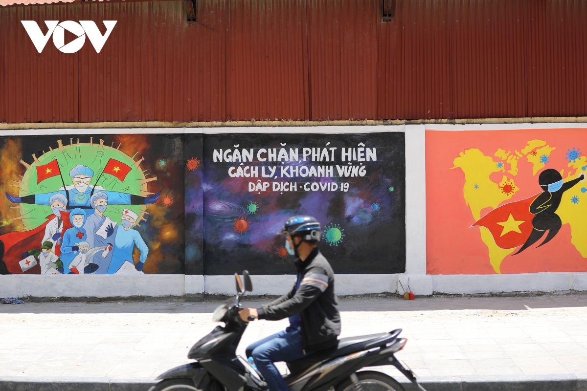 hanoi mural street features paintings showing covid-19 fight picture 2