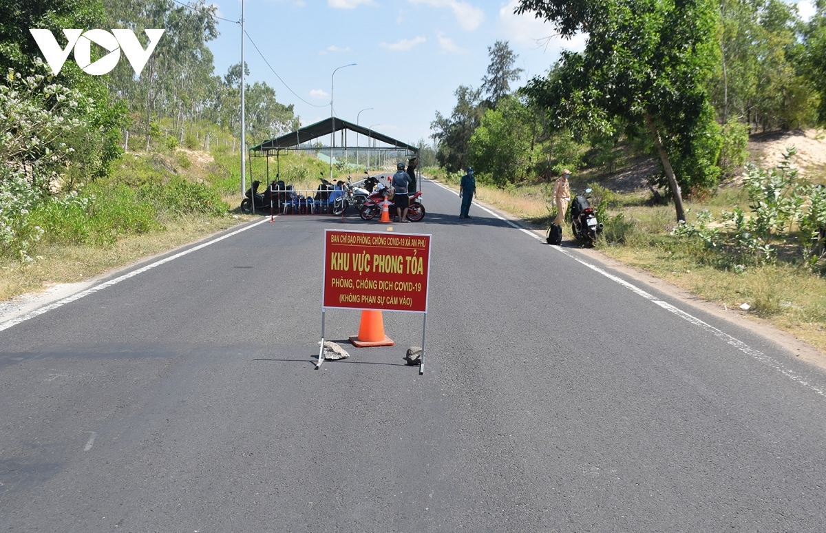 Local people must undergo a temperature check when coming and going.