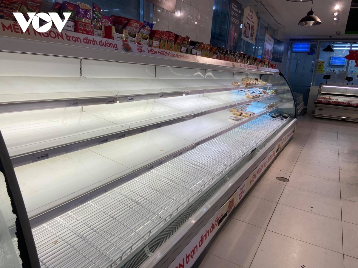 Some shelves displaying fresh food such as pork and chicken quickly run out of stock