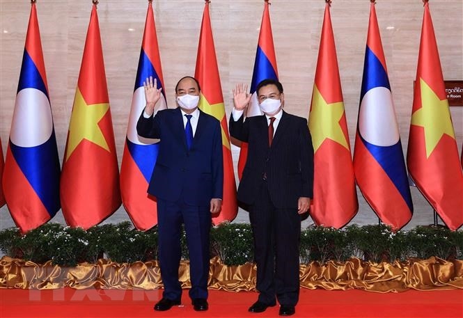Chủ tịch nước Nguyễn Xuân Phúc và Chủ tịch Quốc hội Lào Saysomphone Phomvihane. (Ảnh: Thống Nhất/TTXVN)