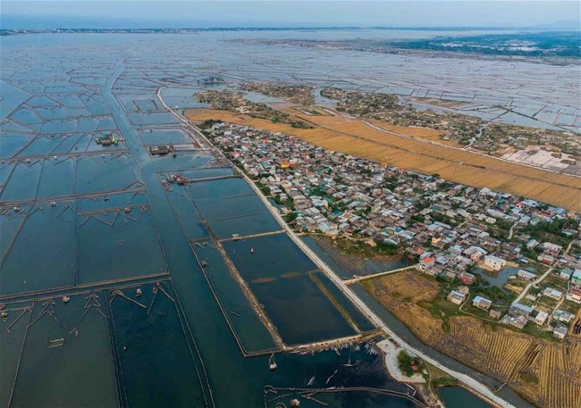 tranquil village by largest brackish lagoon in southeast asia picture 1