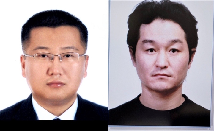 Yon Taiyi (left) and Nam Kiwon, wanted by the INTERPOL, will be handed over to the Korean police at Da Nang International Airport. 