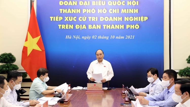 President Nguyen Xuan Phuc meets with National Assembly delegates of Ho Chi Minh City and local business representatives.