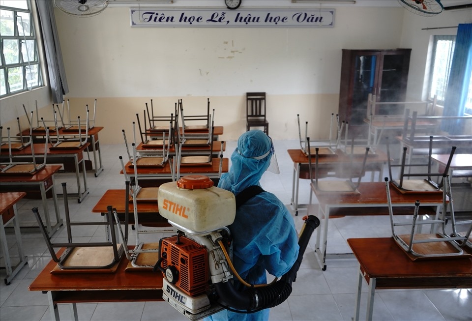 Spraying disinfectant at Nguyen Du high school in District 10