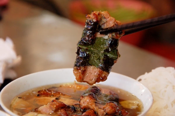 Bun cha (vermicelli with grilled pork and fresh herbs) is one of Vietnam's renowned traditional dishes